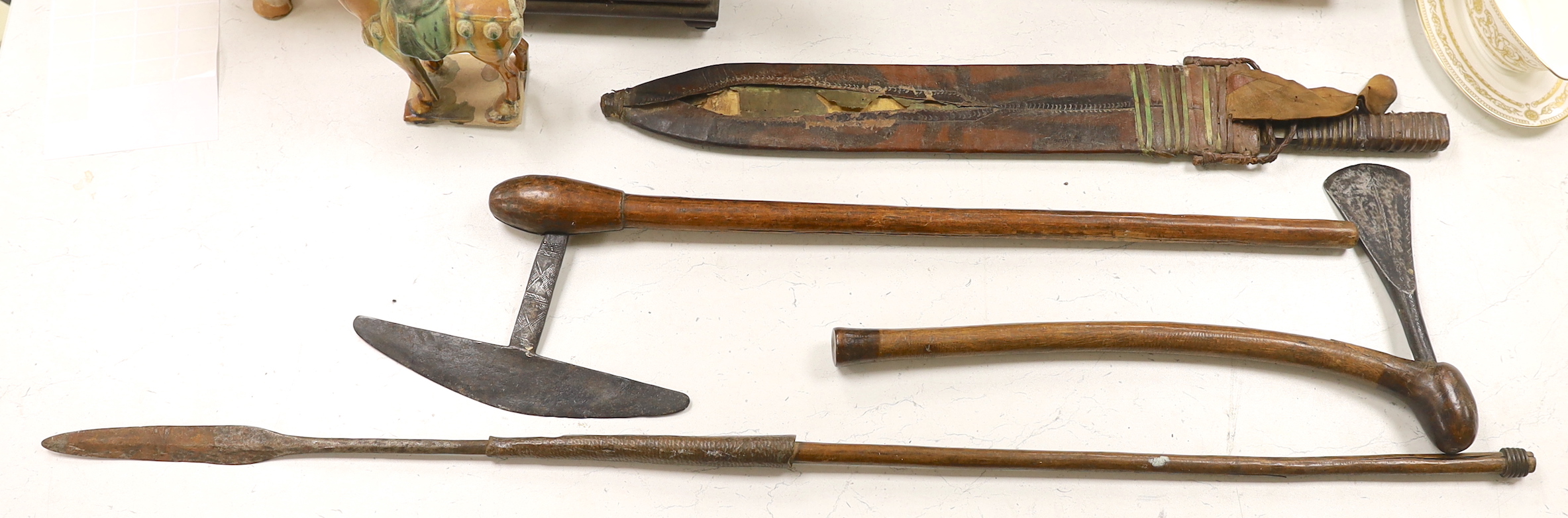 Zulu weapons and a machete, the blade stamped ‘Grape? Robert. M. Needham Sheffield’